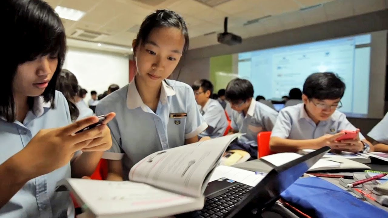 Students collaborating in a modern classroom in Singapore